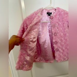 Pink fur coat with jeweled buttons